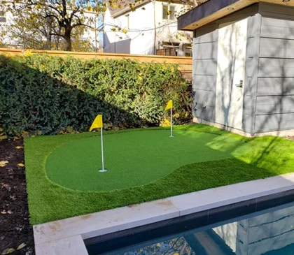 A small putting green installed in the backyard of a client in Downtown, Toronto by Elite Courts