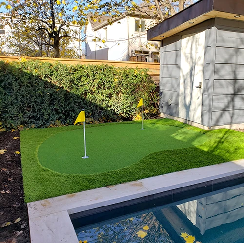 A small putting green installed in the backyard of a client in Downtown, Toronto by Elite Courts
