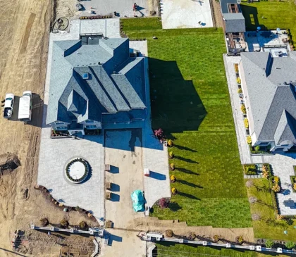 Aerial view of a mansion in Caledon where Elite Courts installed a custom design red Raptors basketball court