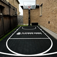 A custom basketball court installed by Elite Courts for Platinum Condo Broker owner in his backyard