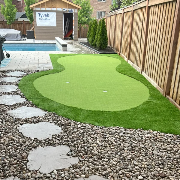 A putting green installed in a client's backyard in Caledon West by Elite Courts
