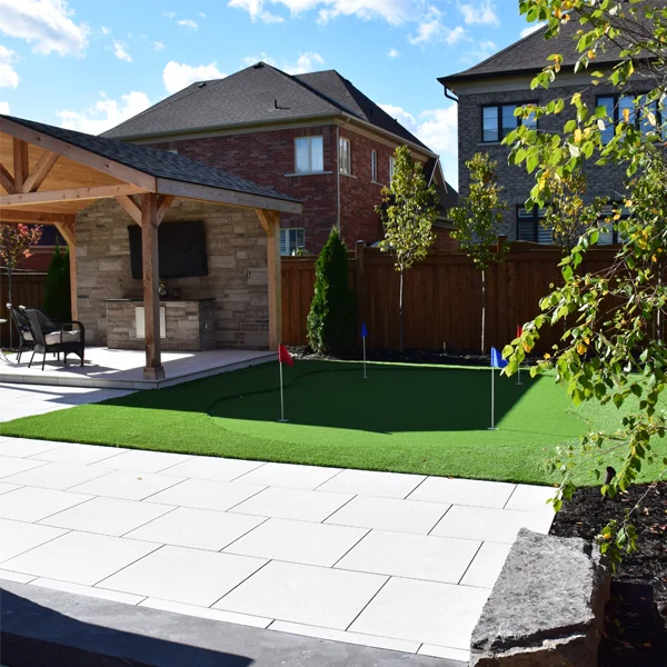 A putting green installed in a client's backyard in the Greater Toronto Area by Elite Courts
